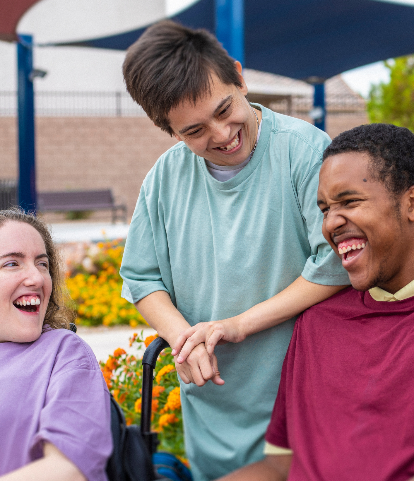 A support worker and the person they support together outdoors